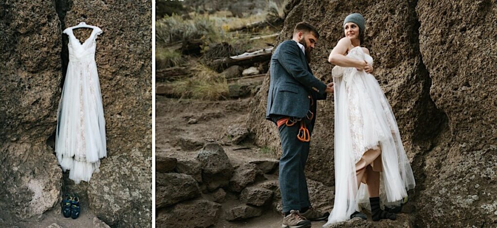 Picture of wedding dress hanging on rocks and groom helping bride zip up dress.