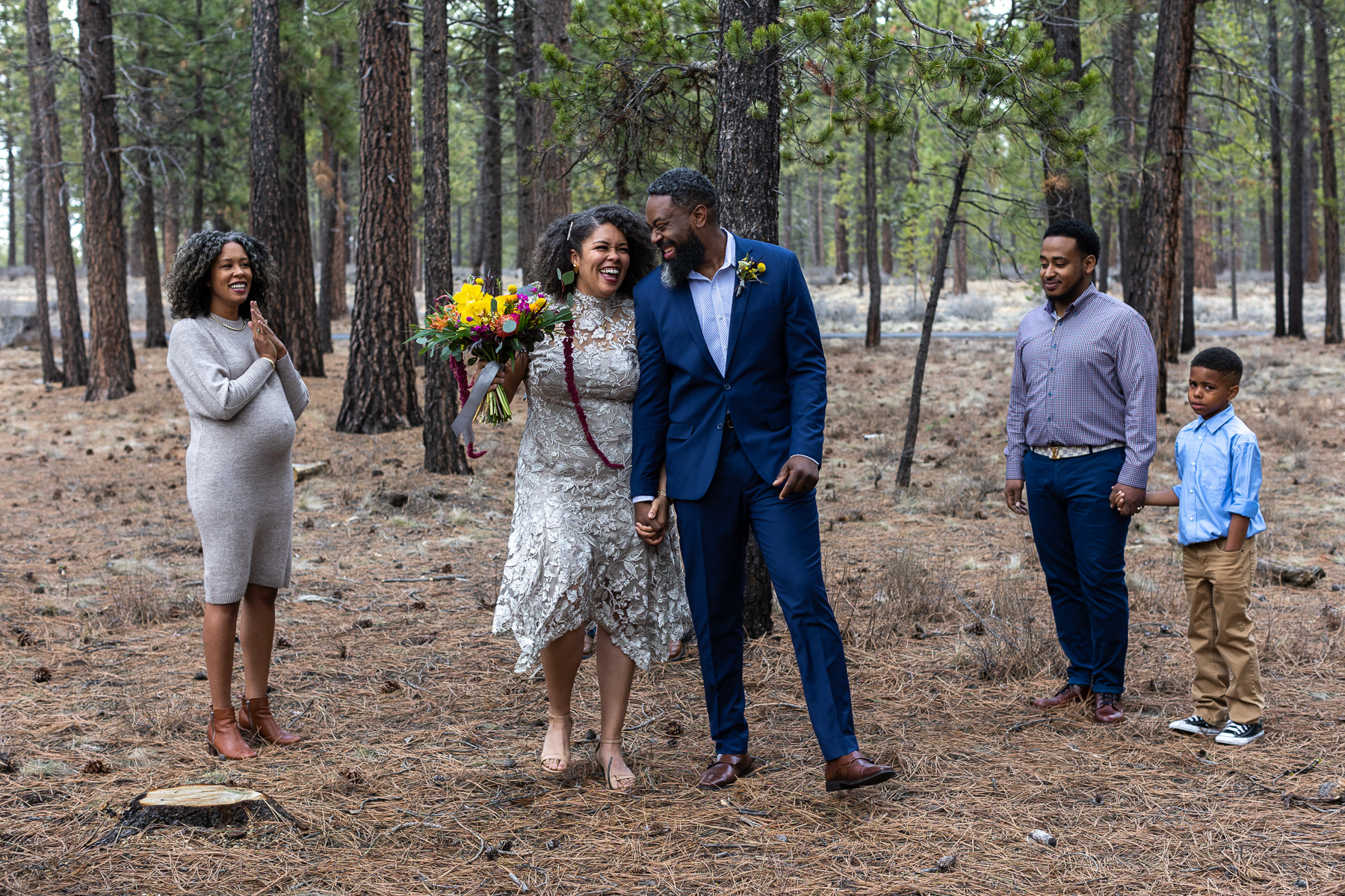 Couple says "I do" with their closest friends with them in the forest.