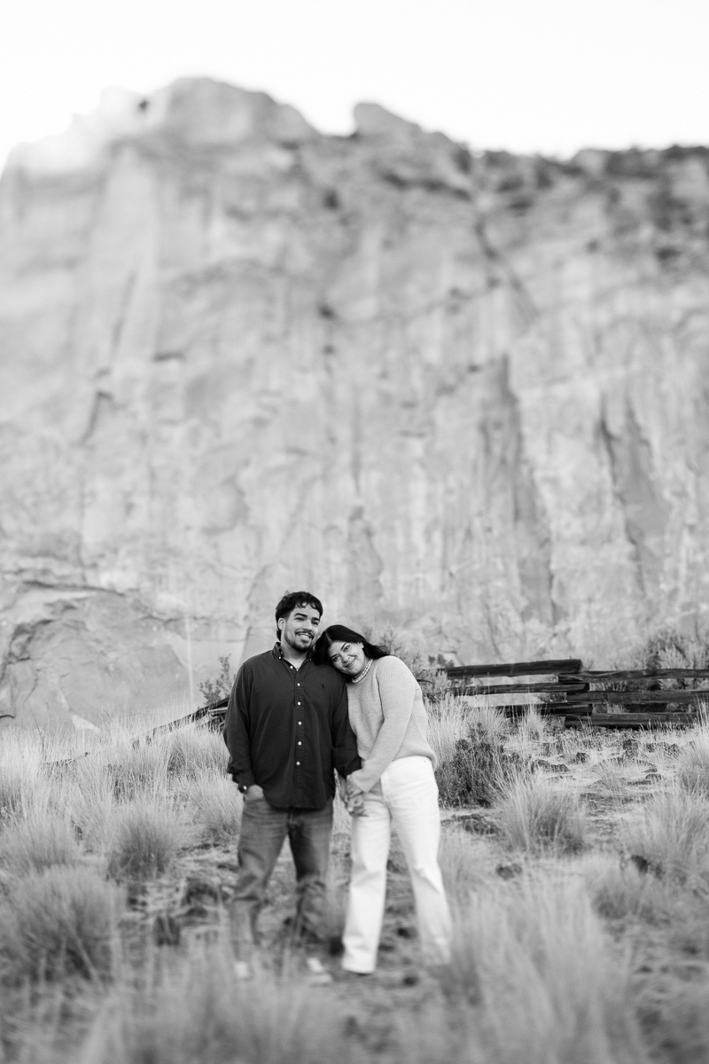 Black and white image of a couple holding hands at Smith Rock State park.
